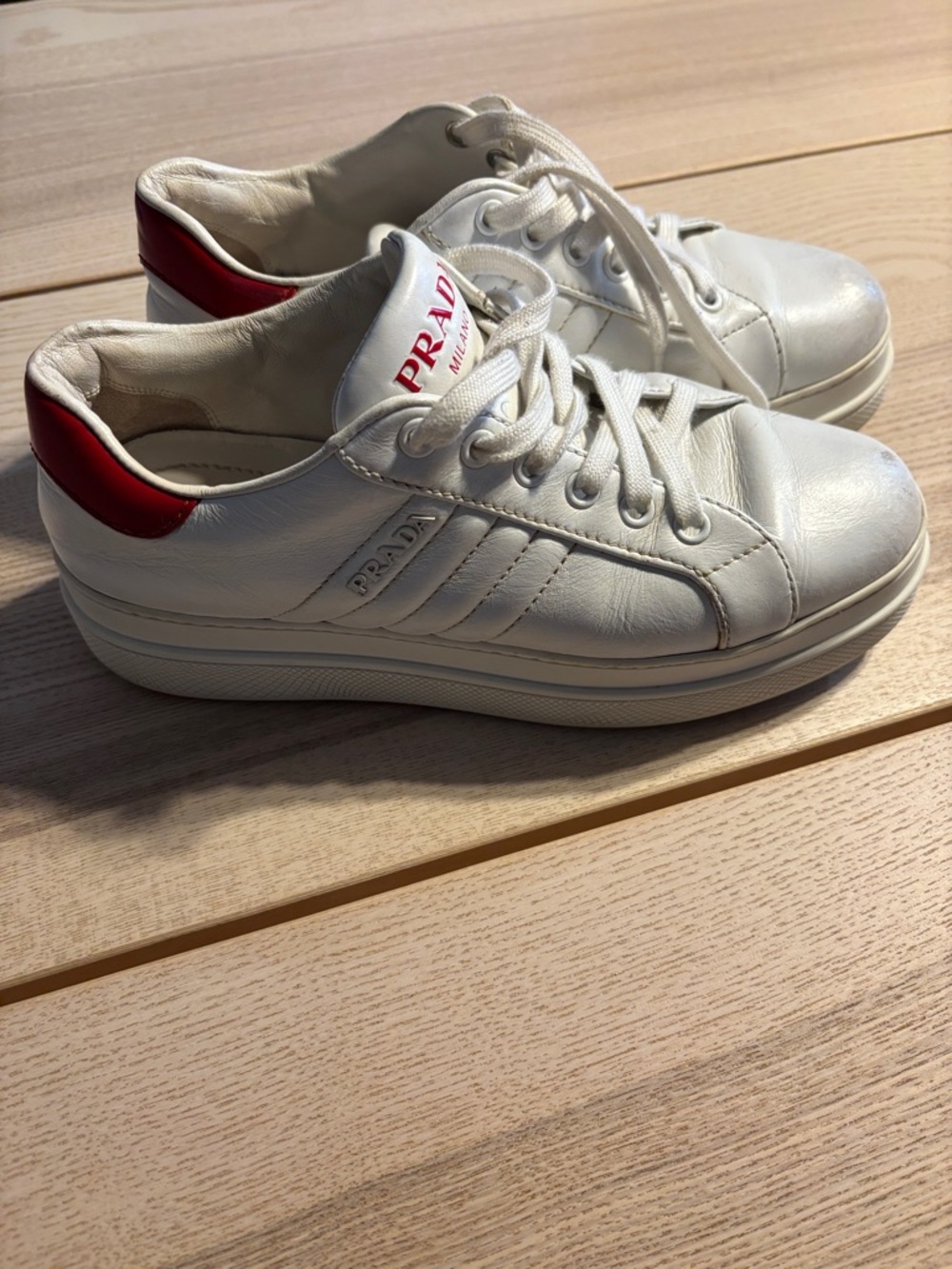 Prada White Leather Sneakers with Red Heel Tab